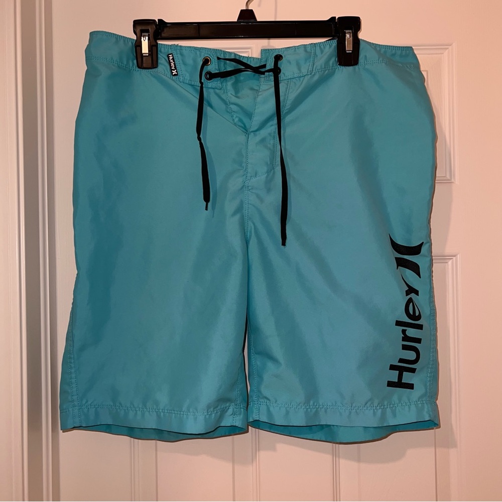 turquoise Hurley board shorts